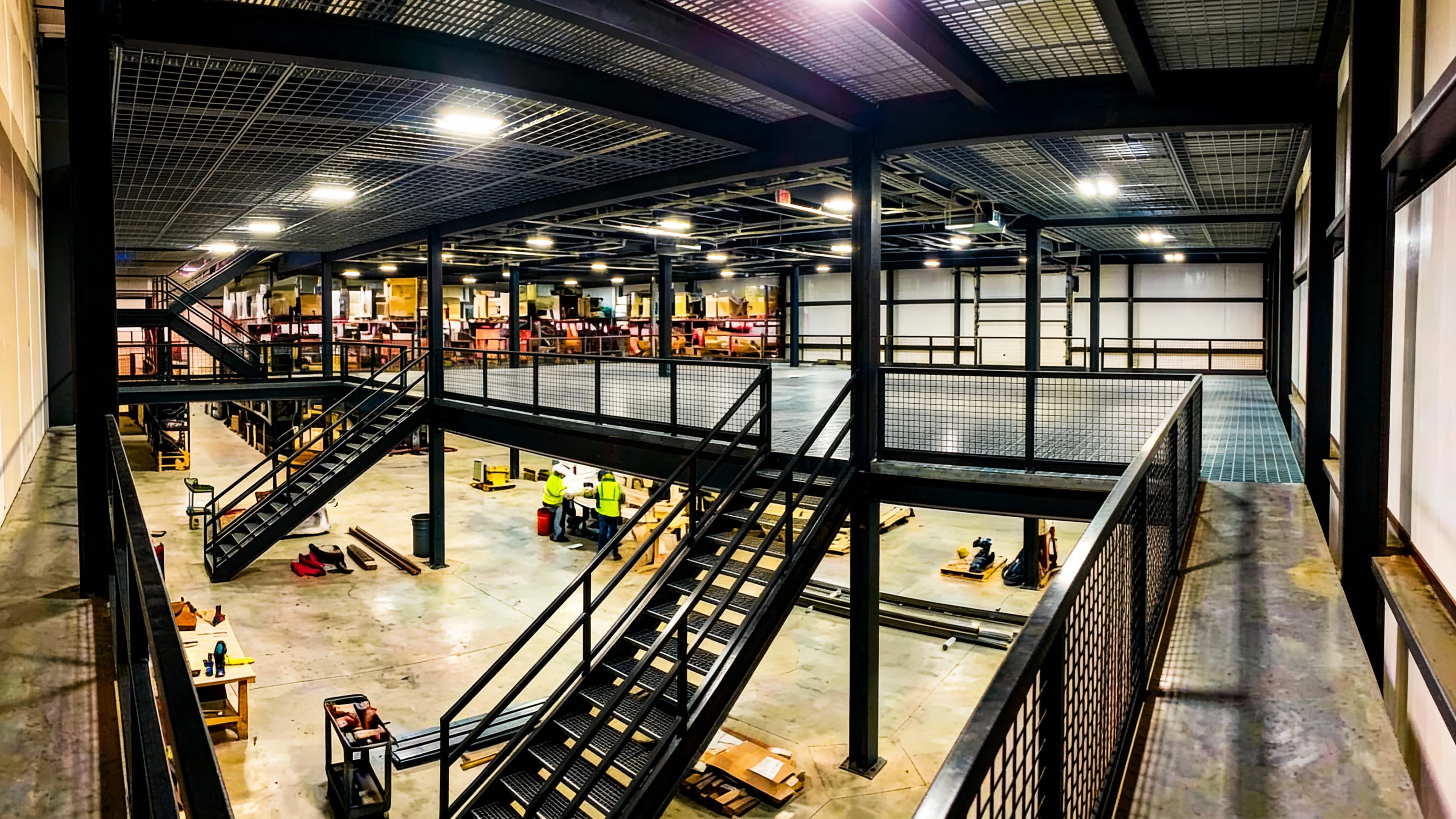 Mezzanine triple story floors installation by Shelving SA